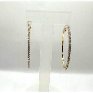 Medium sized gold-toned circular hoops lined with rhinestones